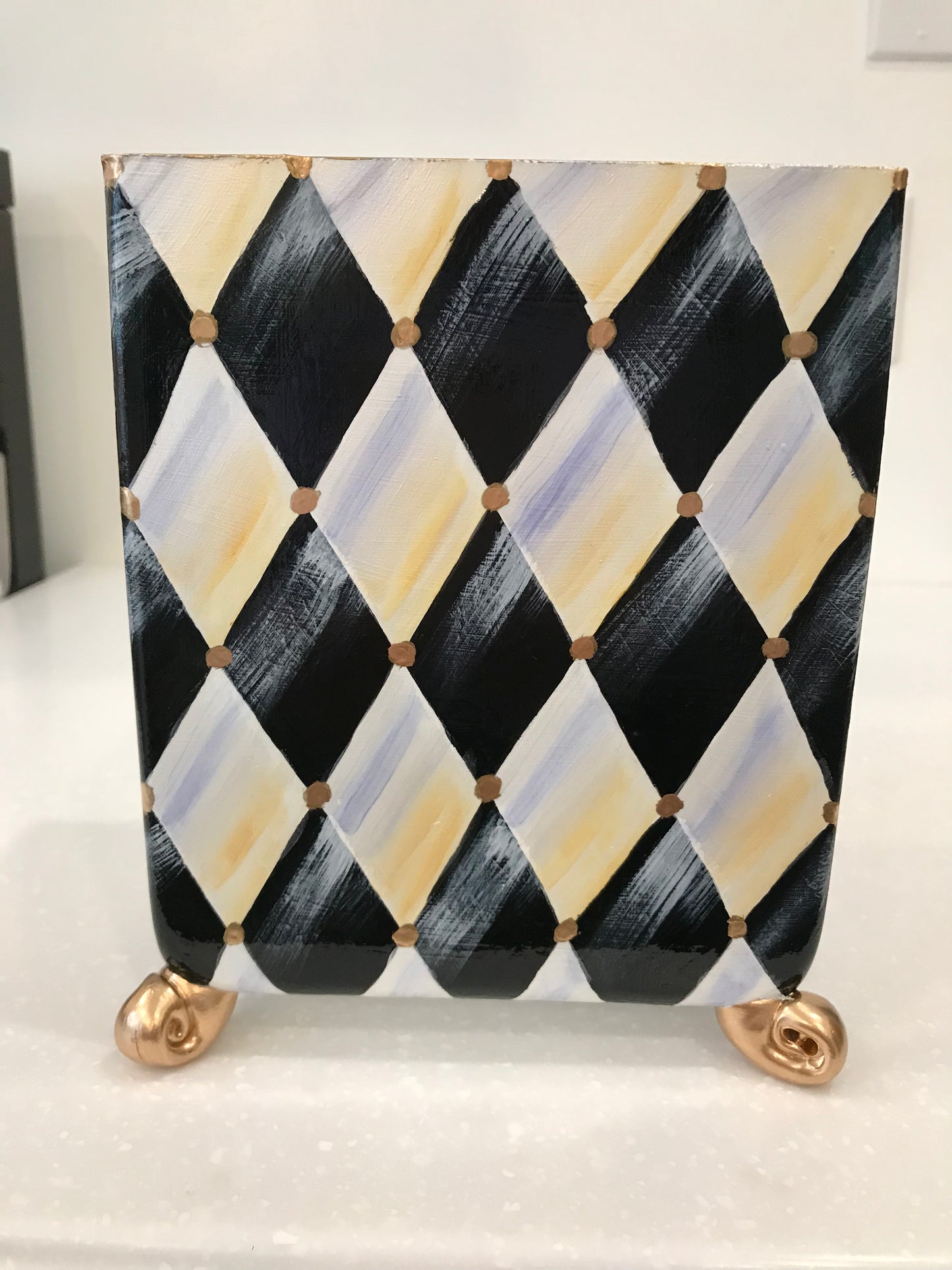 Whimsical harlequin vase with golden feet