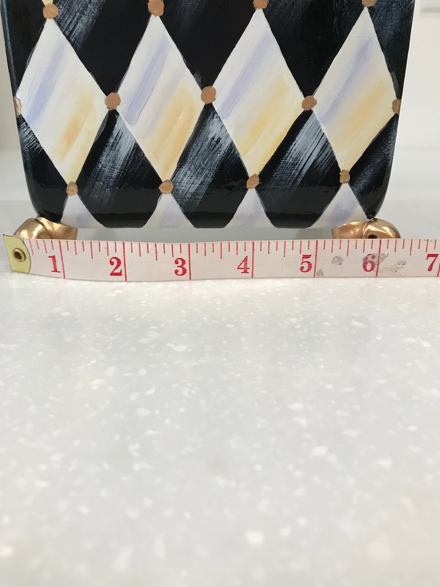 Whimsical harlequin vase with golden feet