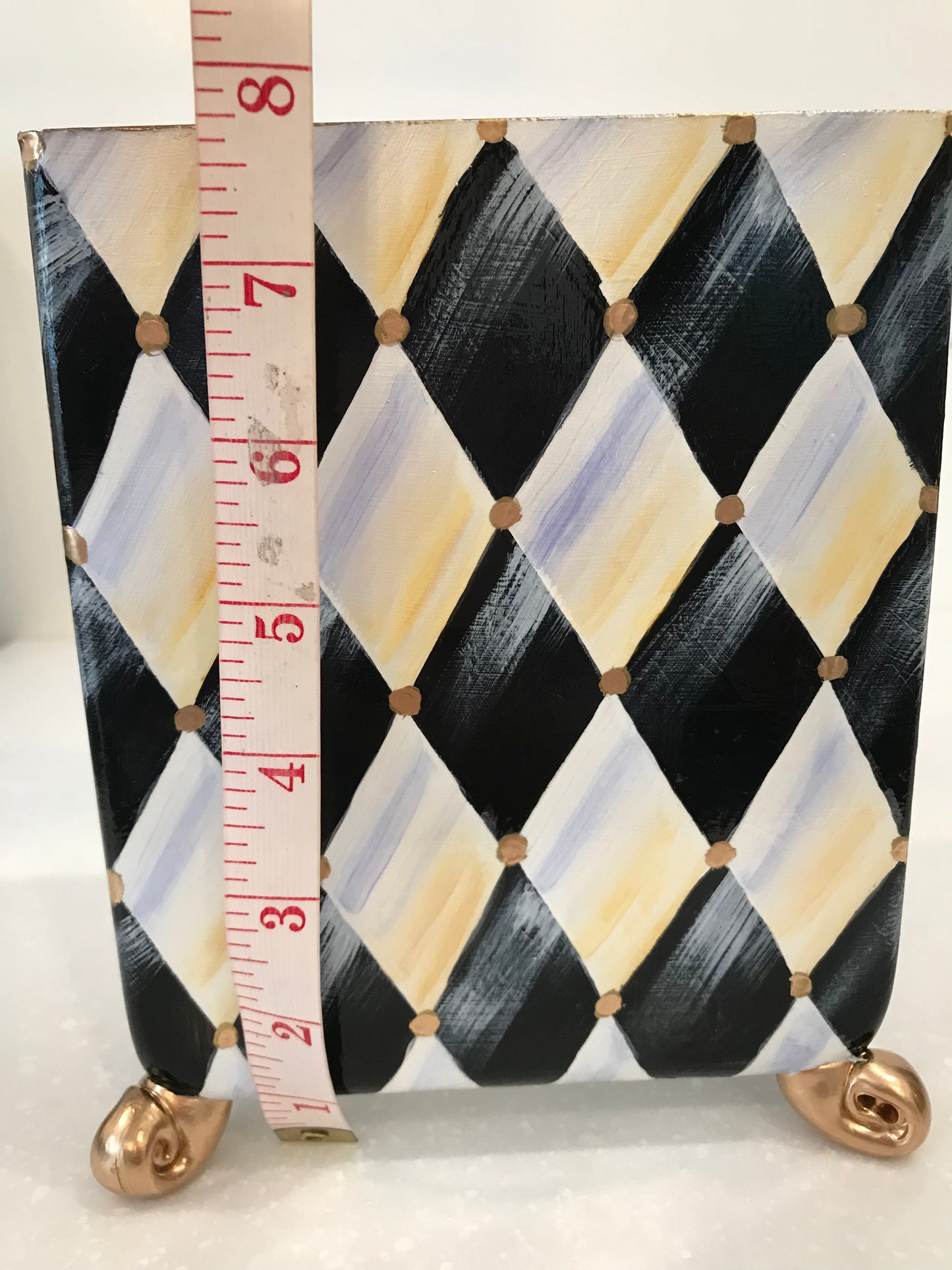Whimsical harlequin vase with golden feet