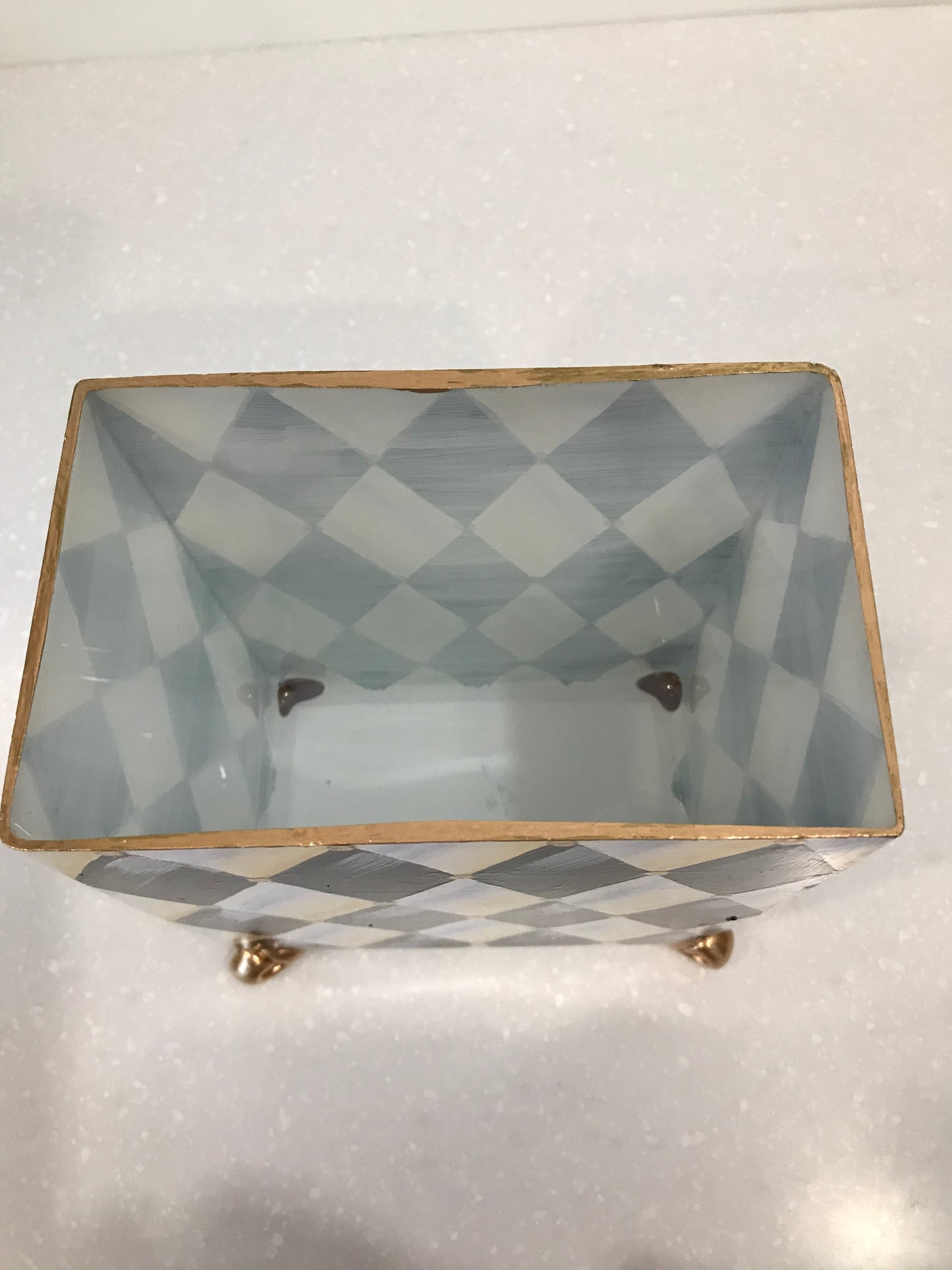 Whimsical harlequin vase with golden feet