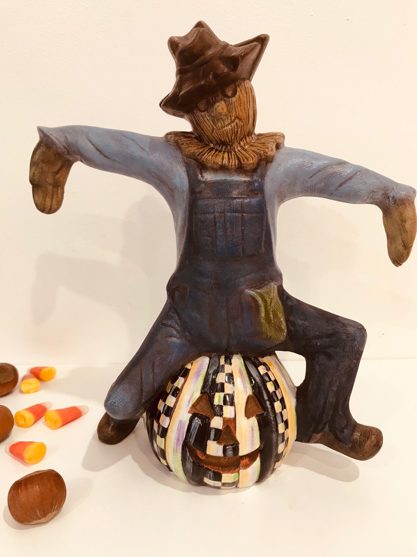 Ceramic scarecrow sitting on a pumpkin 🎃